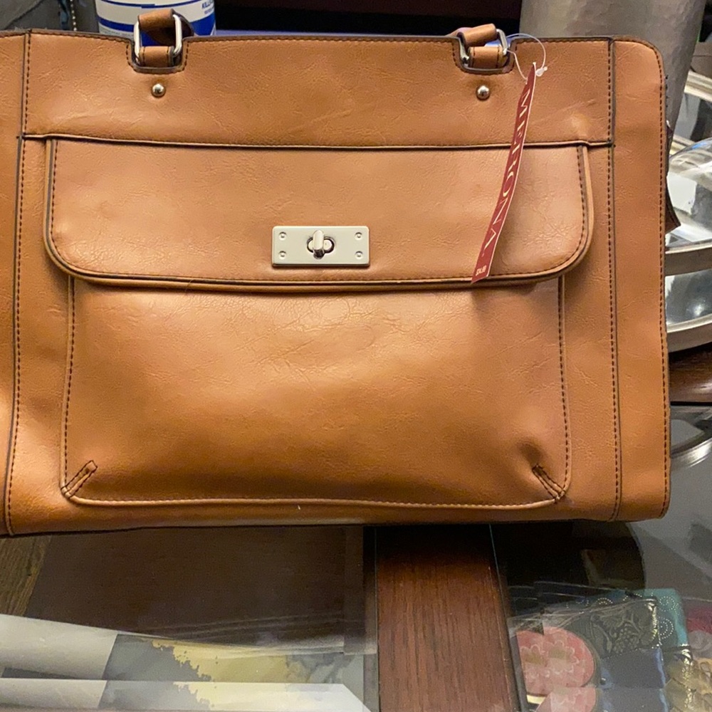 Tan bag with silver accent and shoulder strap